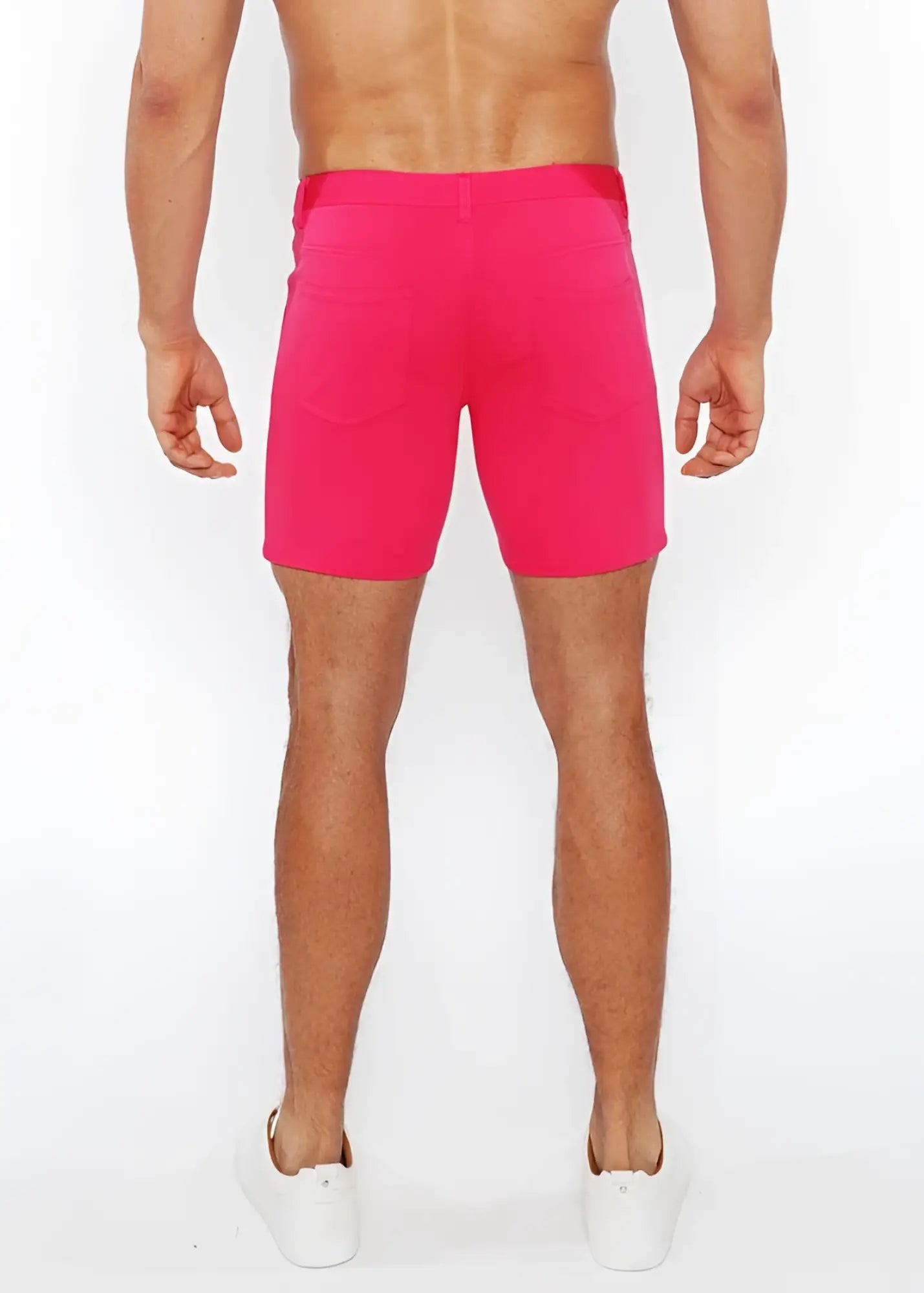 Bright pink stretch knit shorts with fitted waistband and side pockets ideal for athletic use