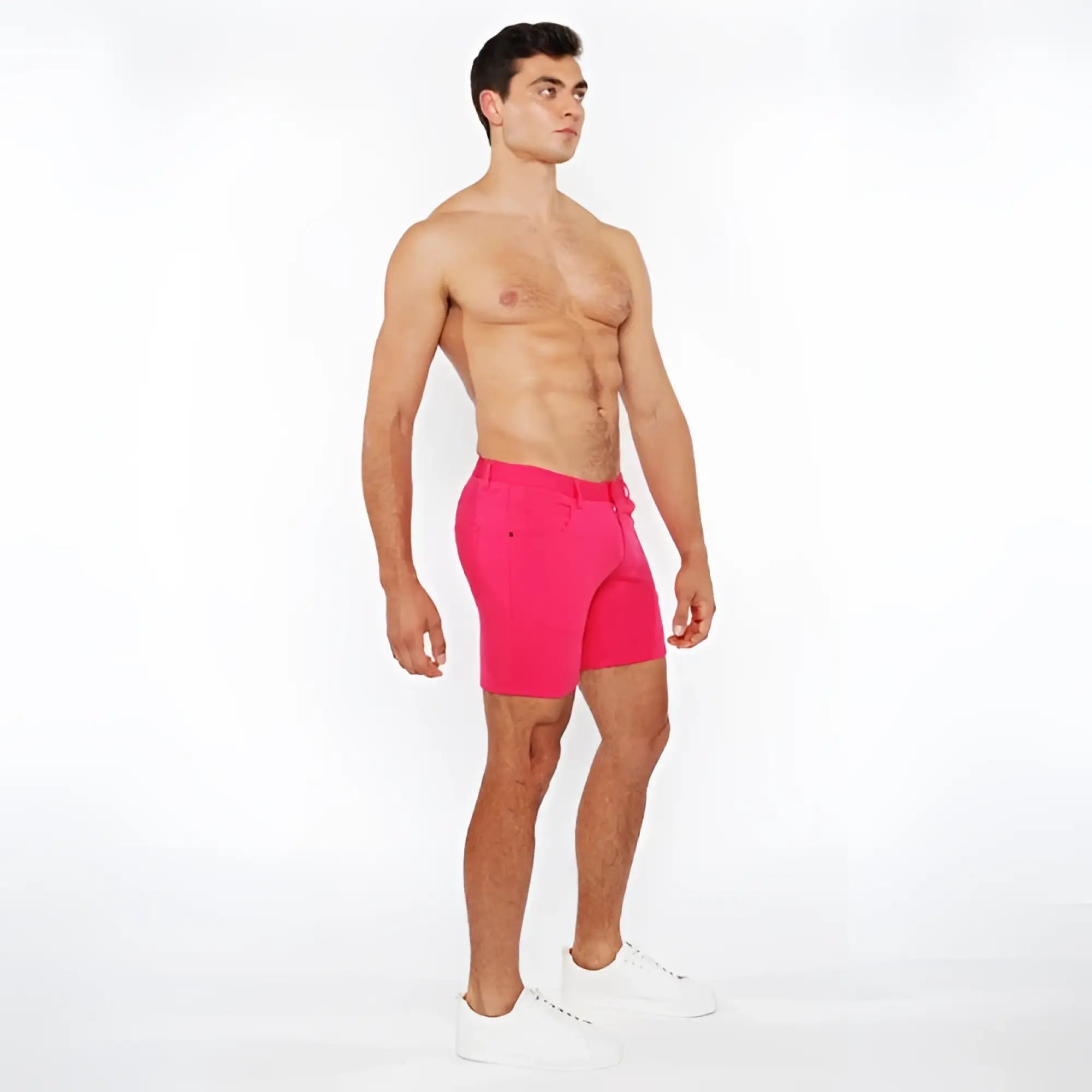Bright pink stretch knit shorts with tailored fit and belt loops for comfortable athletic wear