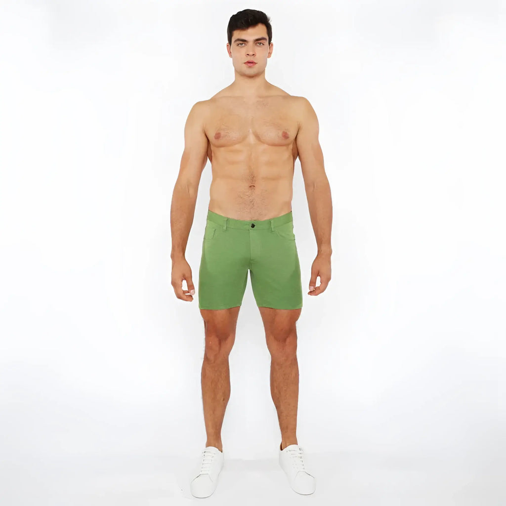 Green stretch knit shorts with a tailored fit and subtle stitching details in a soft stretch fabric