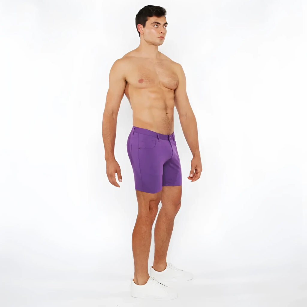 Purple stretch knit short athletic shorts with tailored fit and subtle side pockets for active wear