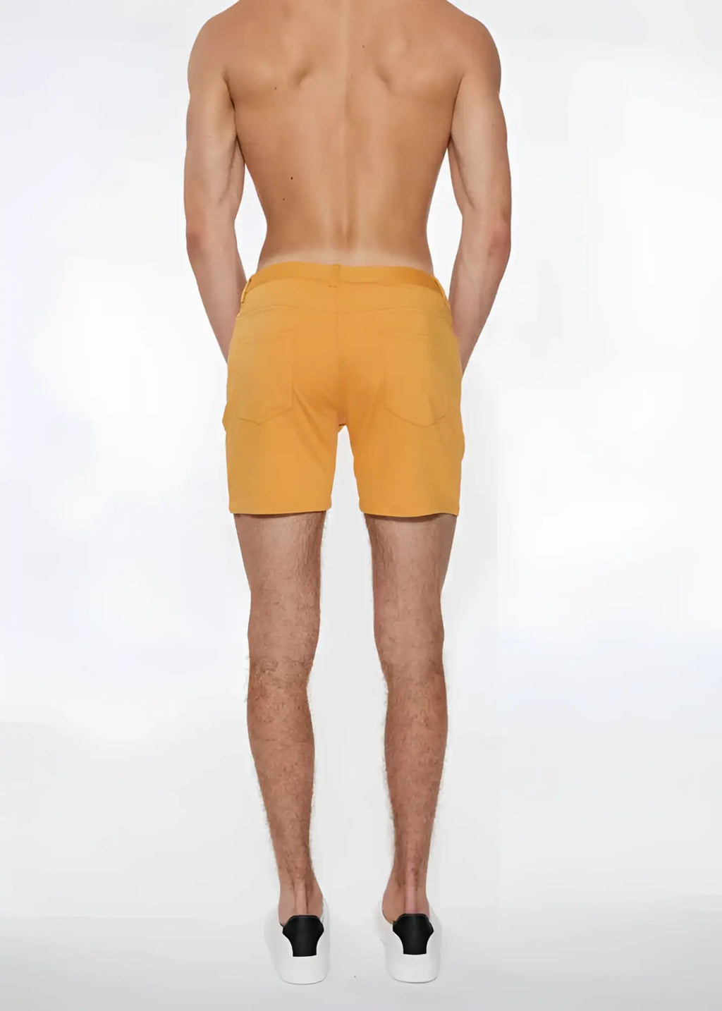 A pair of mustard yellow st33le stretch knit shorts with side pockets in size 29 apricot peel color