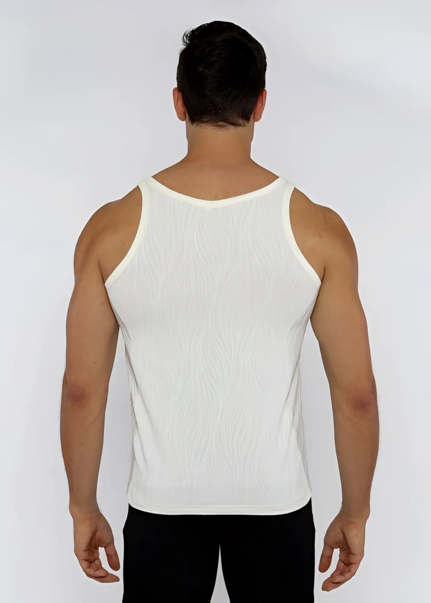 White ribbed tank top made of textured knit fabric perfect for casual summer wear