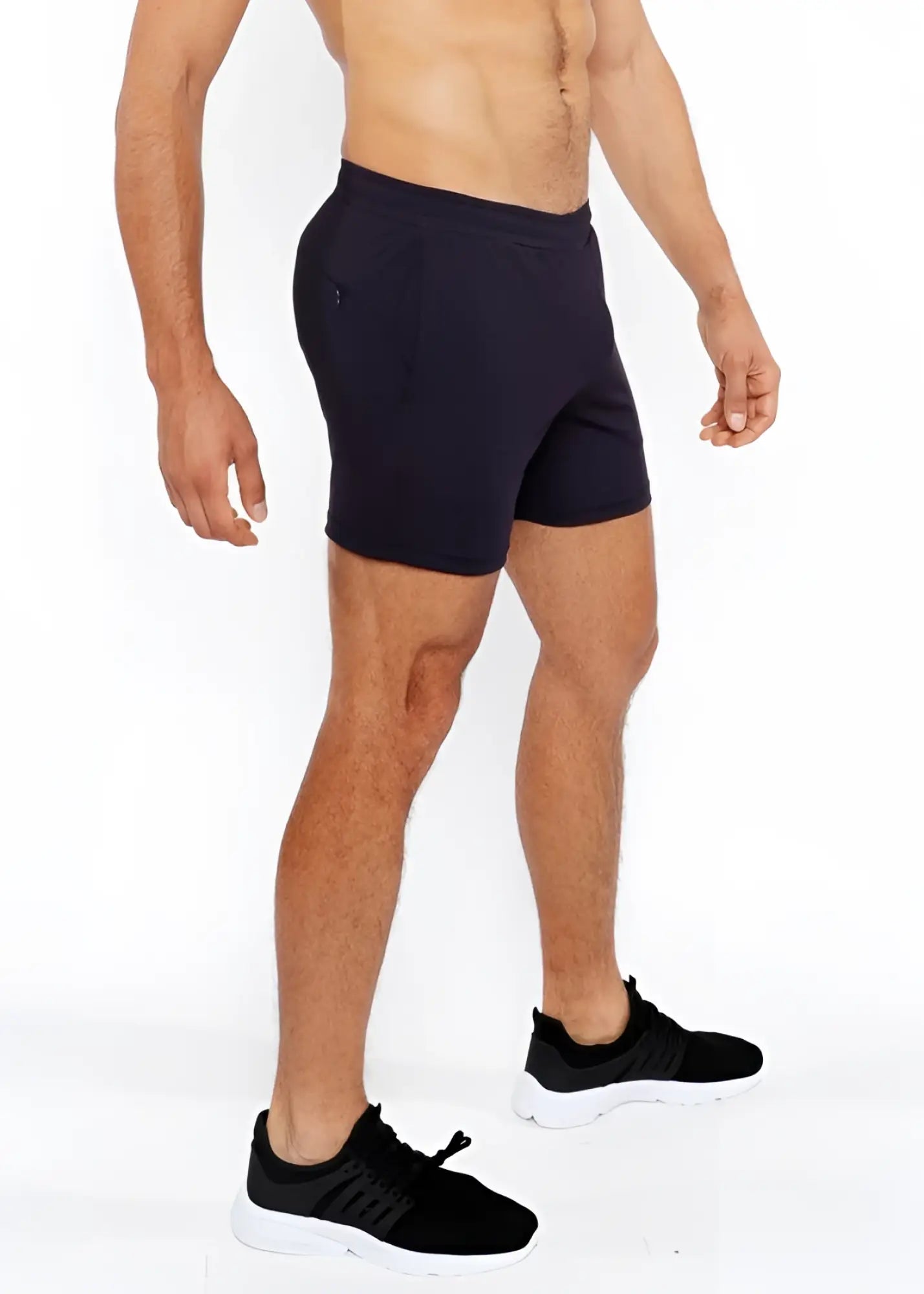 Black textured mesh stretch performance shorts with sleek form-fitting design and subtle side pockets