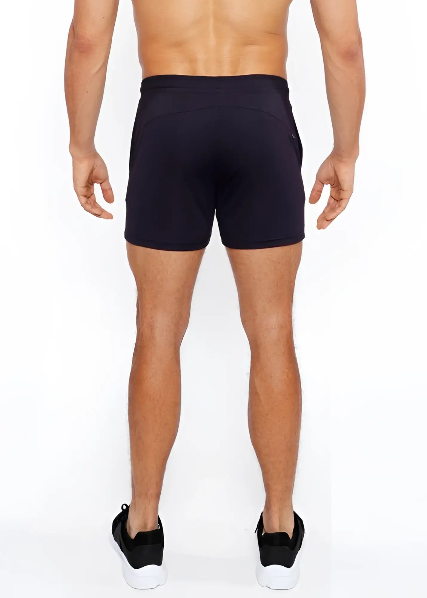 Black textured mesh stretch performance shorts with sleek form-fitting design and subtle side pockets