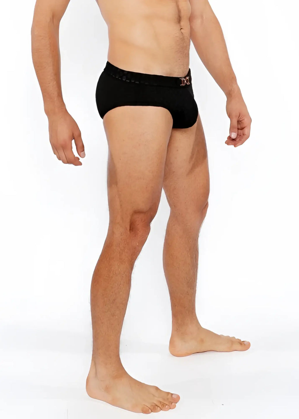 Black men’s textured swim briefs with front buckle and subtle pink logo on waistband for swimwear use