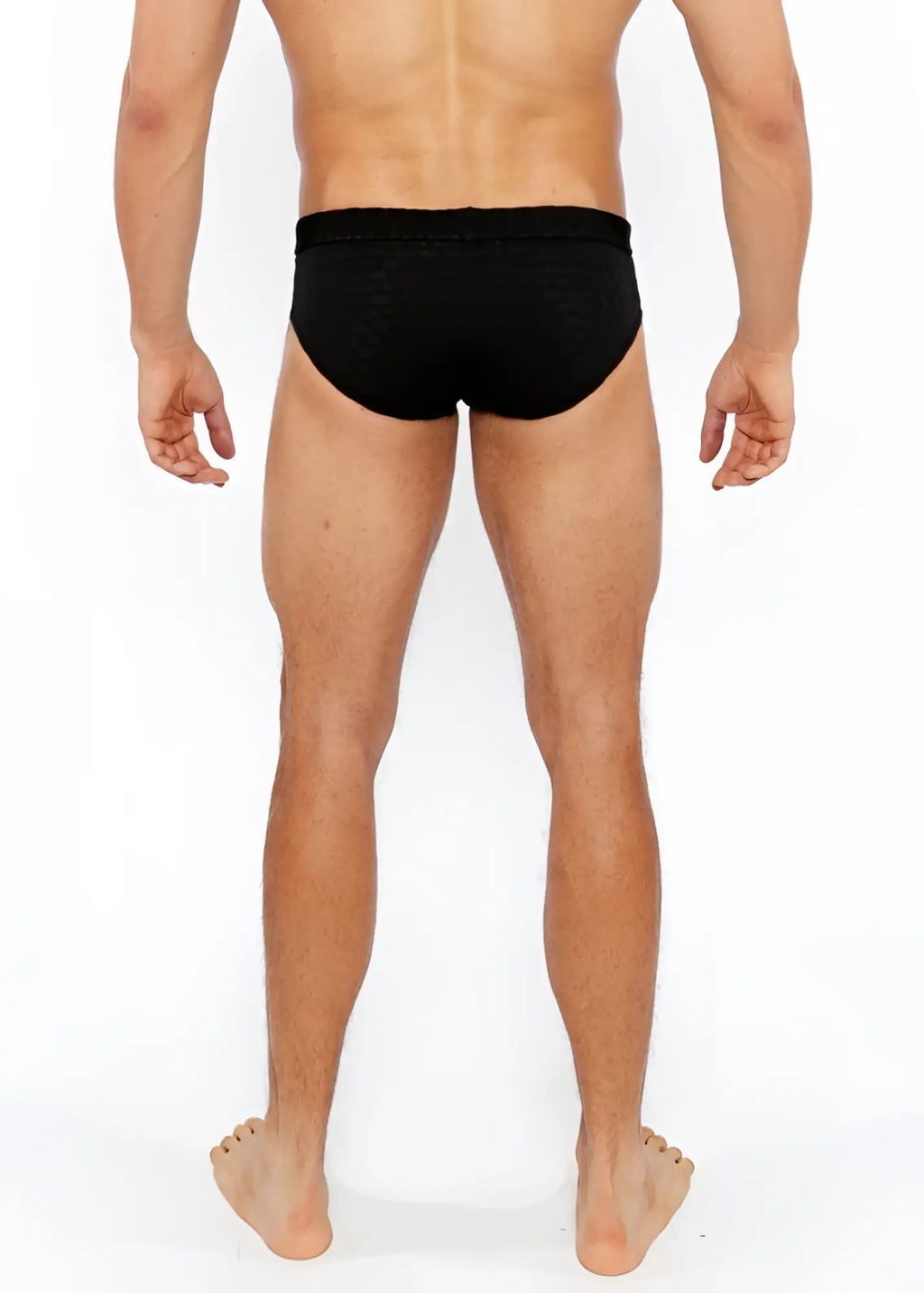 Black textured swim brief with front buckle made of textured fabric for swimming and beachwear use