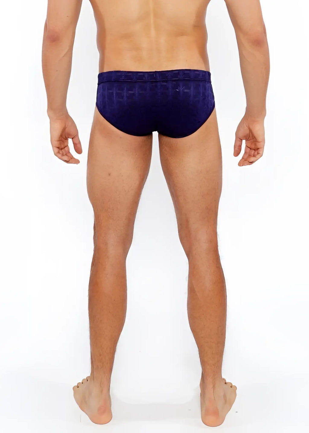 Navy blue textured swim brief with repeating geometric pattern and front buckle for stylish swimwear use
