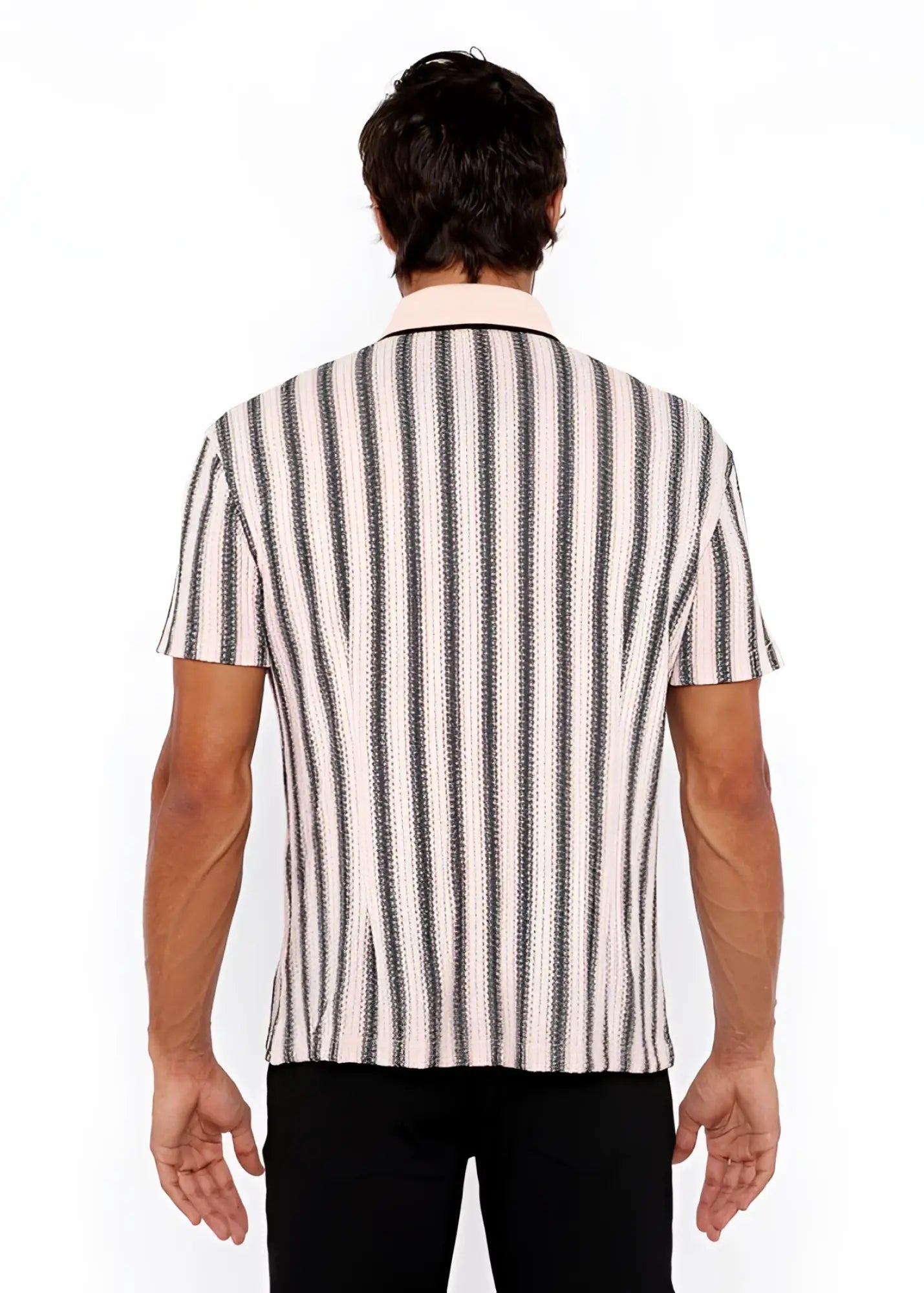 A man wearing a vertical stripe open stretch knit shirt with rib collar in black and off-white textured fabric