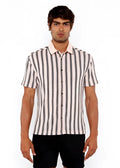A man wearing a black and off-white vertical stripe open stretch knit shirt with rib collar and short sleeves