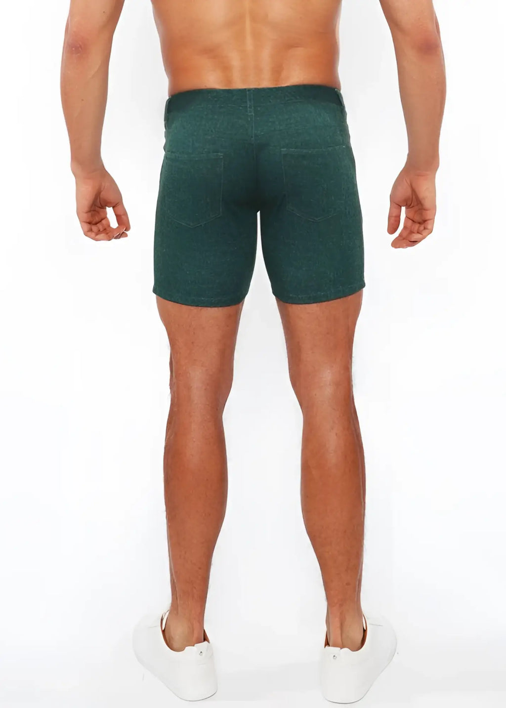 Dark green washed denim stretch knit shorts with subtle texture and two back pockets shown from the back side
