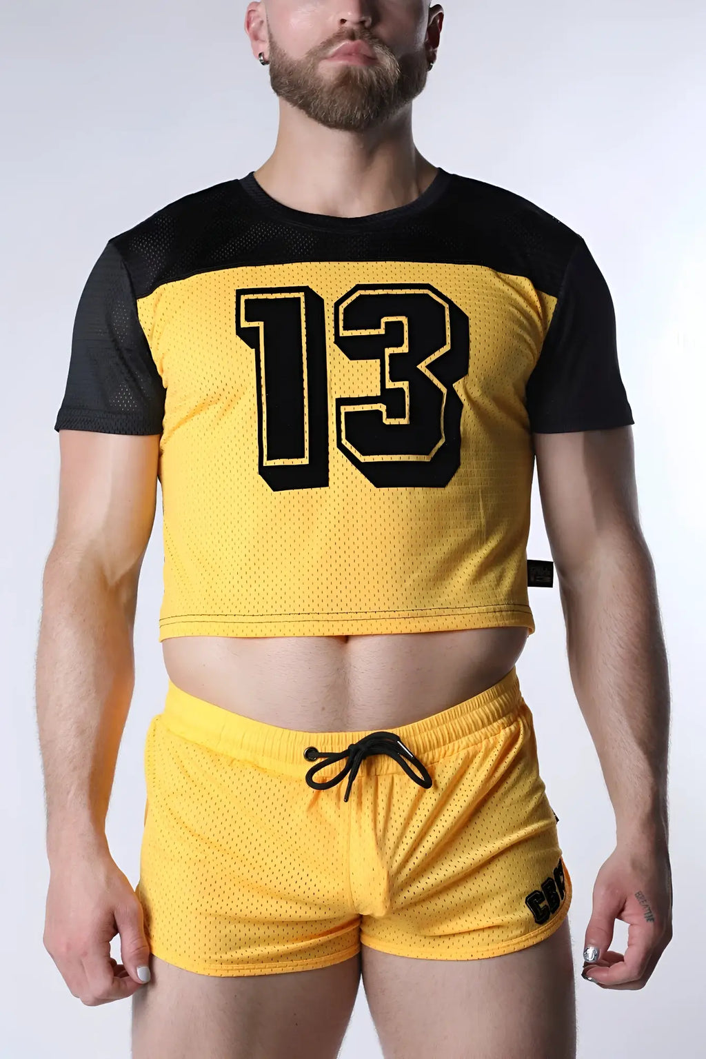 Starter mesh crop top in yellow mesh with black sleeves and bold black 13 outlined in yellow on front