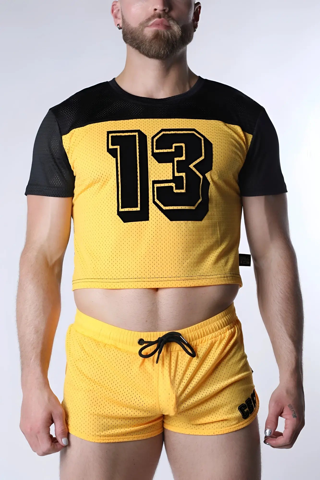 Starter mesh crop top in yellow mesh with black sleeves and bold black 13 outlined in yellow on front