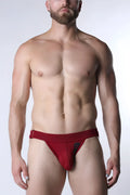 Red mesh briefs with black logo on the side featuring breathable starter mesh jockstrap design
