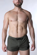 Olive green starter mesh athletic shorts with textured fabric black drawstring and side pocket detail