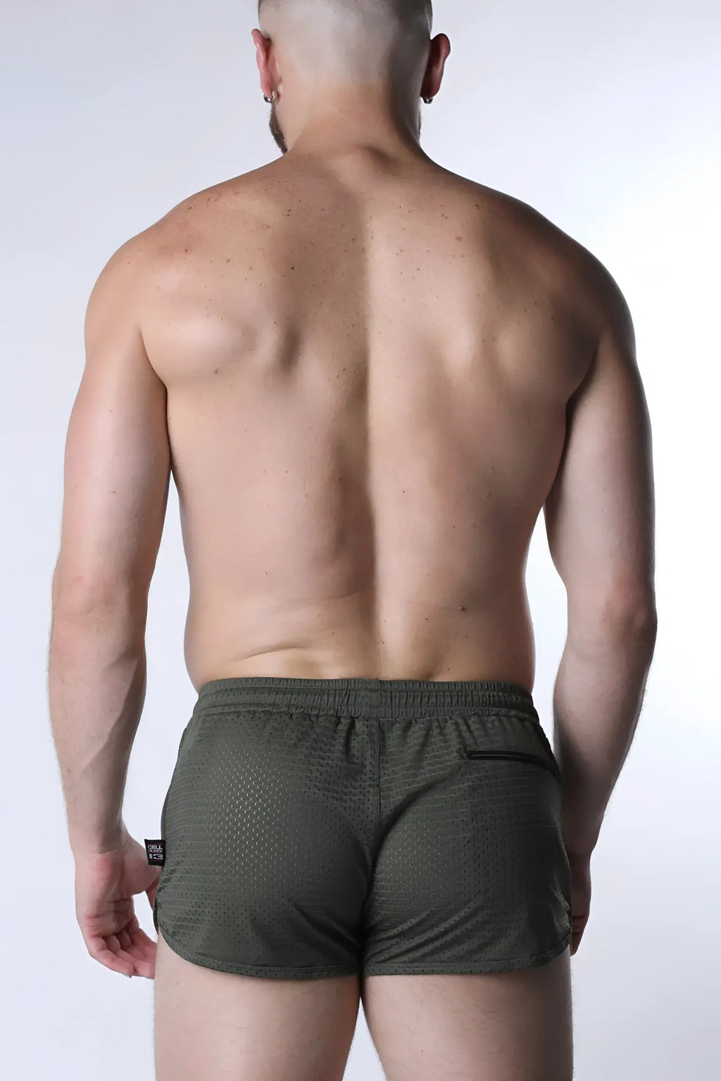 Olive green textured starter mesh athletic shorts with black side pocket and brand tag for sportswear use
