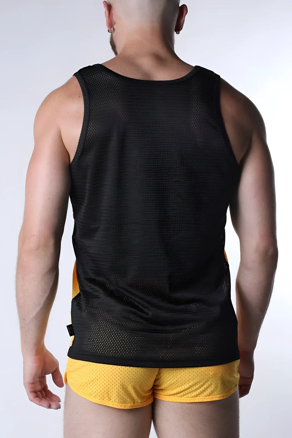 Black mesh starter tank top with yellow side panels designed for breathable athletic wear