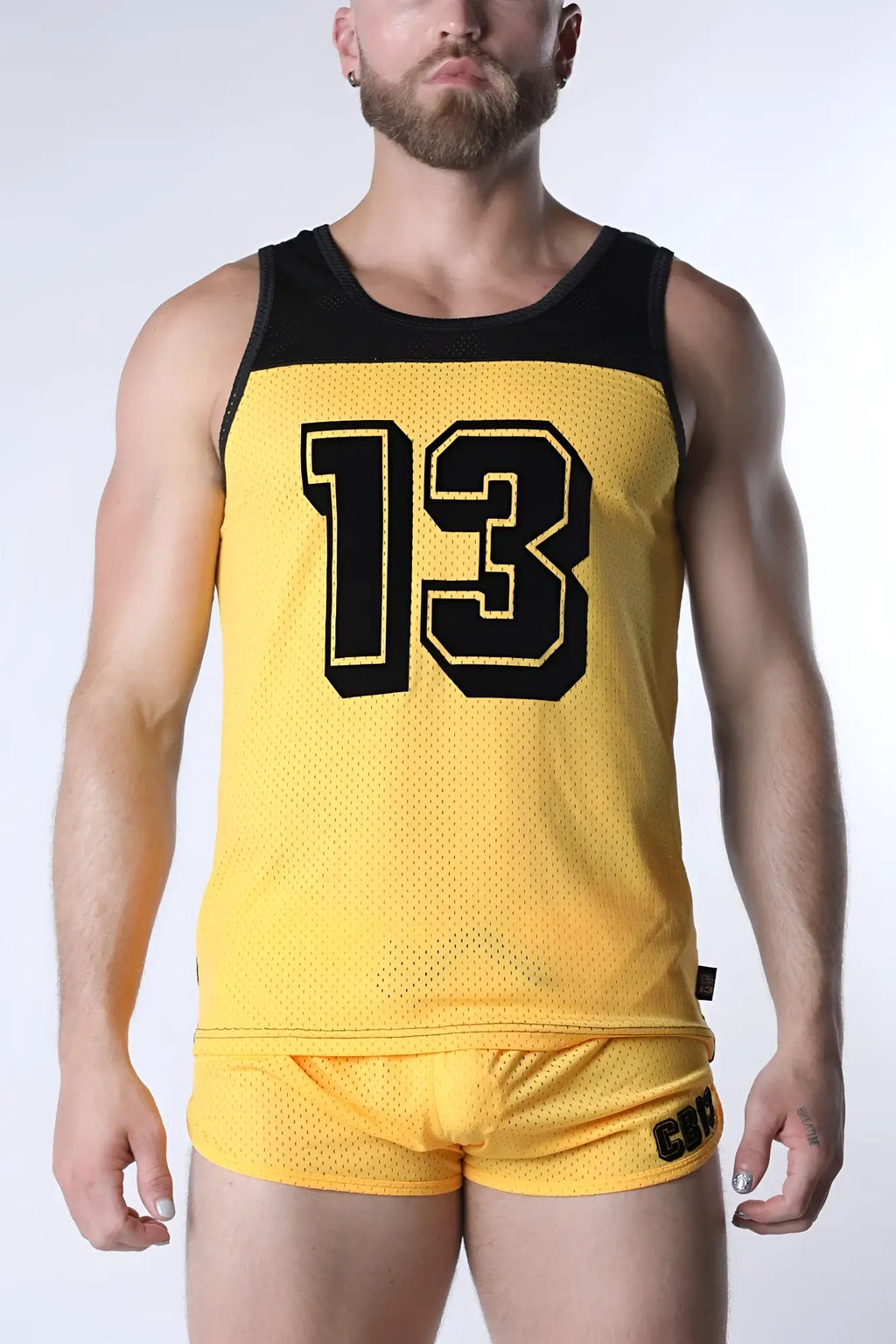 Yellow mesh athletic tank top with black trim and bold black number 13 in vintage sports jersey style by Starter