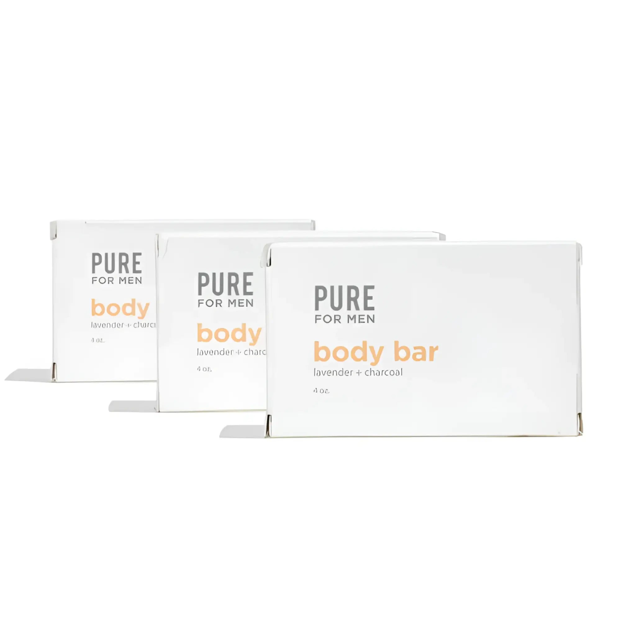 Three white rectangular boxes of pure for men stay ready bar lavender and charcoal body soap with orange and gray text