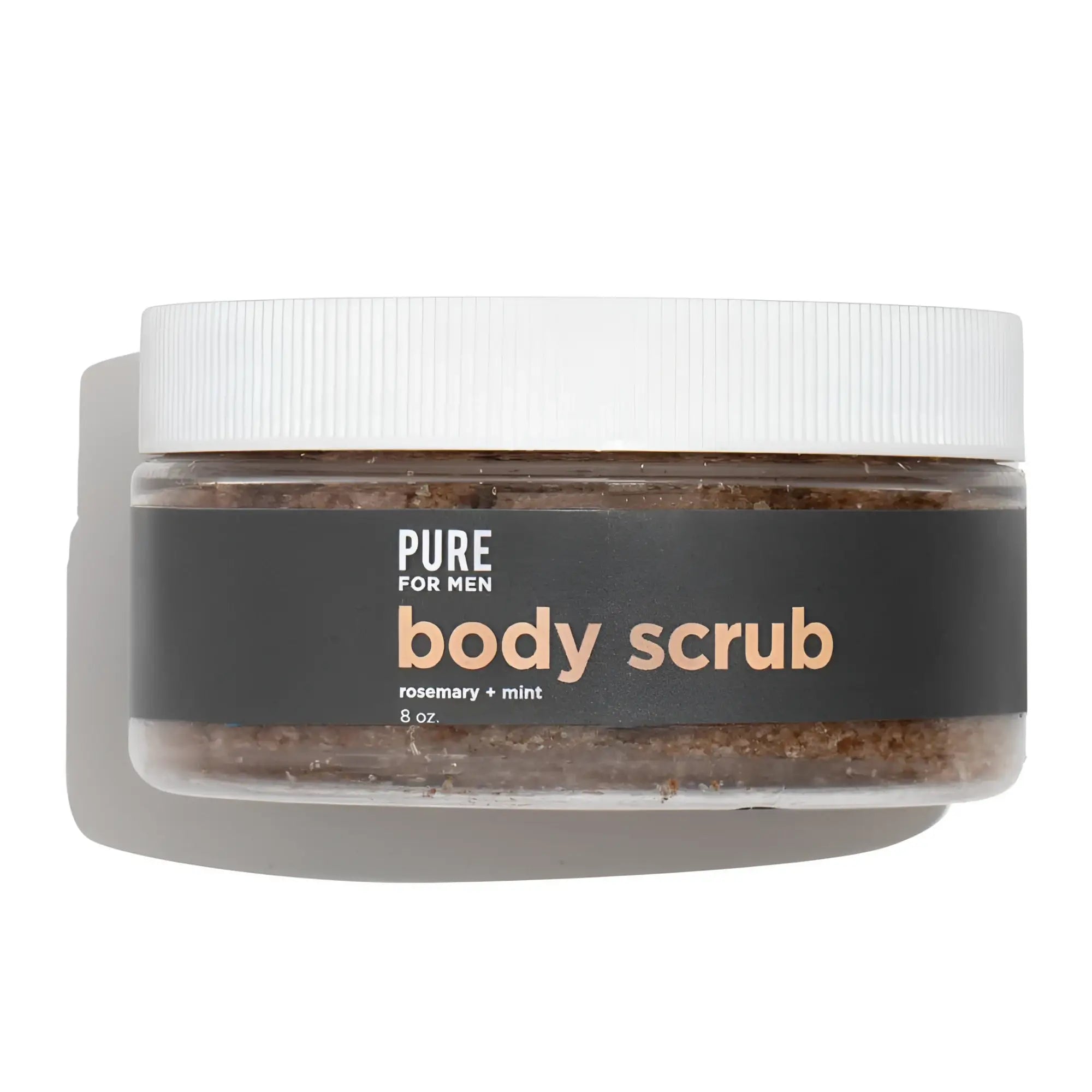 A clear jar with white lid containing brown granular body scrub labeled pure for men in stay ready scrub product