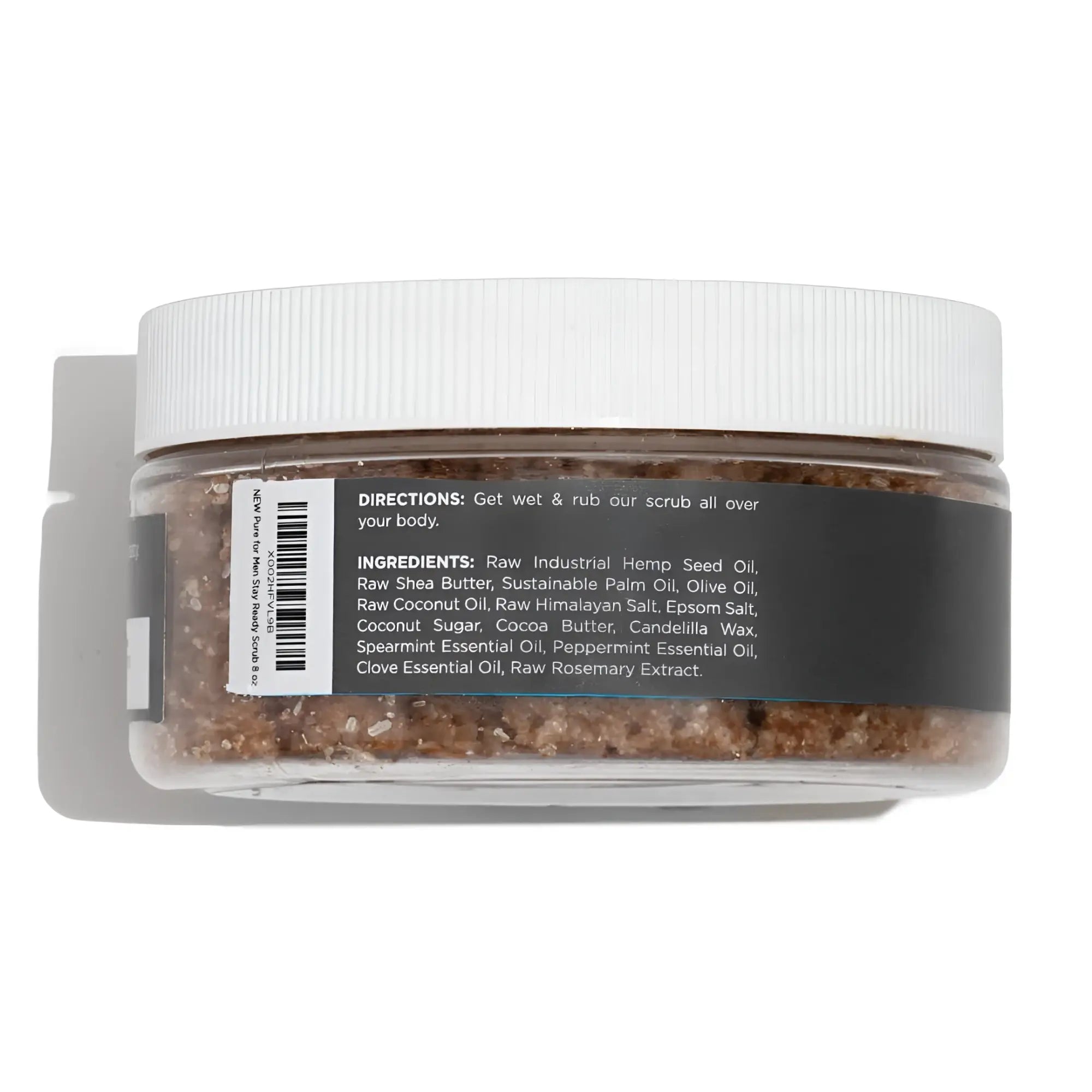 A clear plastic jar with a white ribbed lid containing brown granular stay ready scrub with labeled ingredients and directions