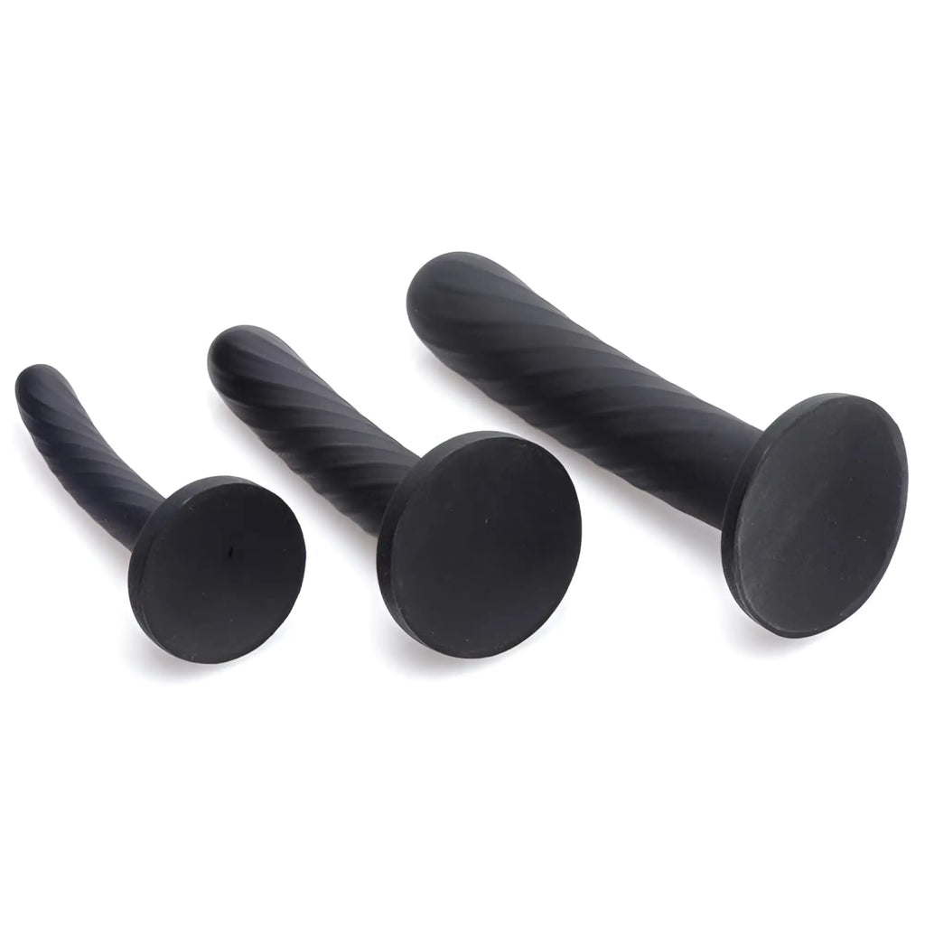 Strap U 3-piece silicone strap-on set in black, featuring three ribbed, spiral-textured phallic attachments.