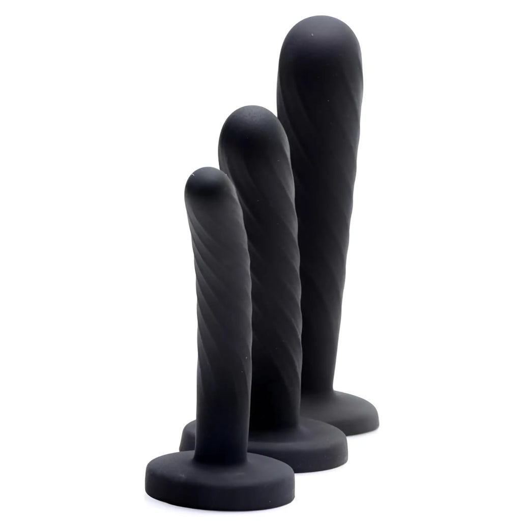 Strap U 3-piece silicone strap-on set in black, featuring three graduated sizes with spiral textured shafts and bases.