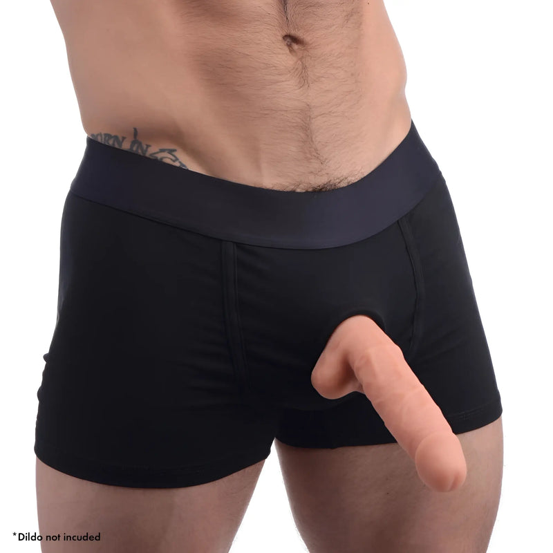 Strap U Armor Boxer Harness in black featuring a central O-ring for a dildo. Worn by a model (dildo not included).