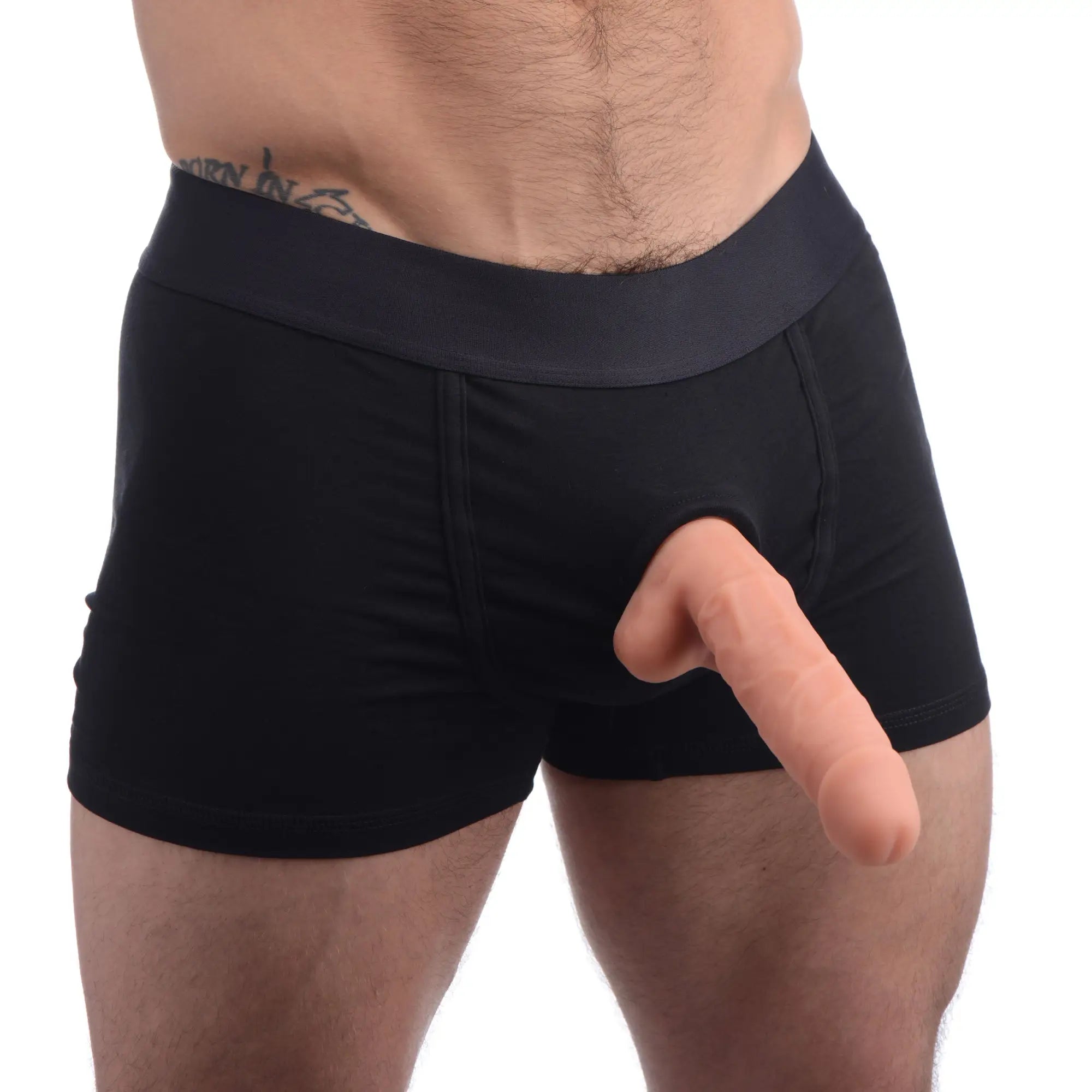 Strap U Incognito black boxer harness with a hidden O-ring, modeled with a realistic silicone dildo attached.