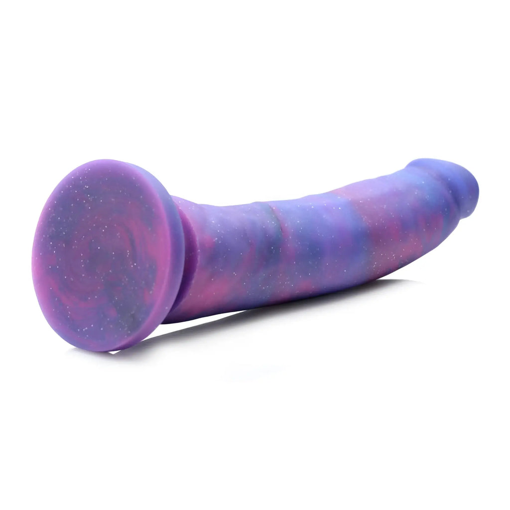 Strap U Magic Stick silicone dildo: curved, glittery purple and pink marbled design with a flat circular base.