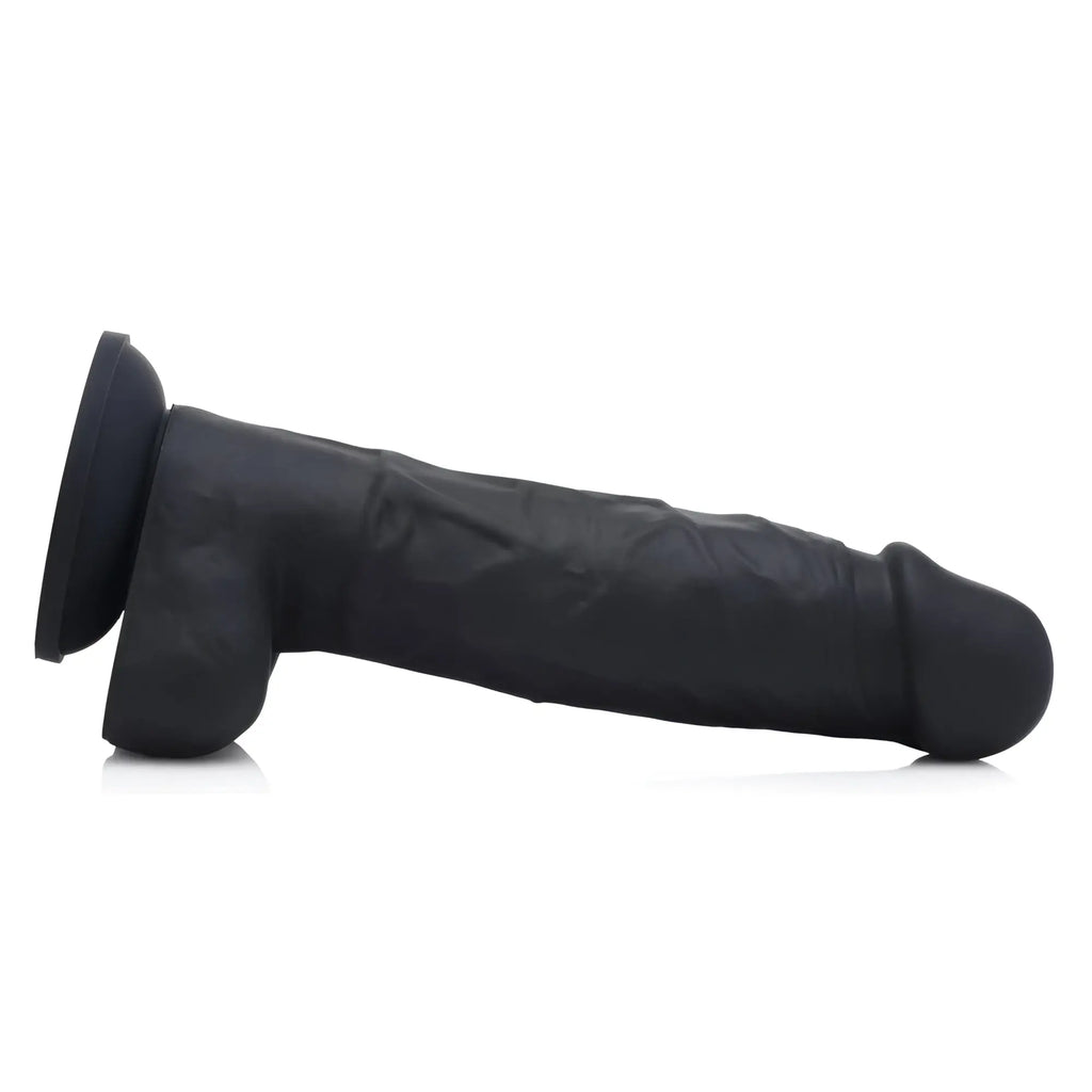 Strap U Power Pecker 7-inch black silicone dildo with textured detail and a suction cup base, shown from the side.