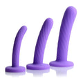 Strap U Tri-Play 3-piece silicone dildo set featuring purple, spiraled, flared-base dildos in three different sizes.