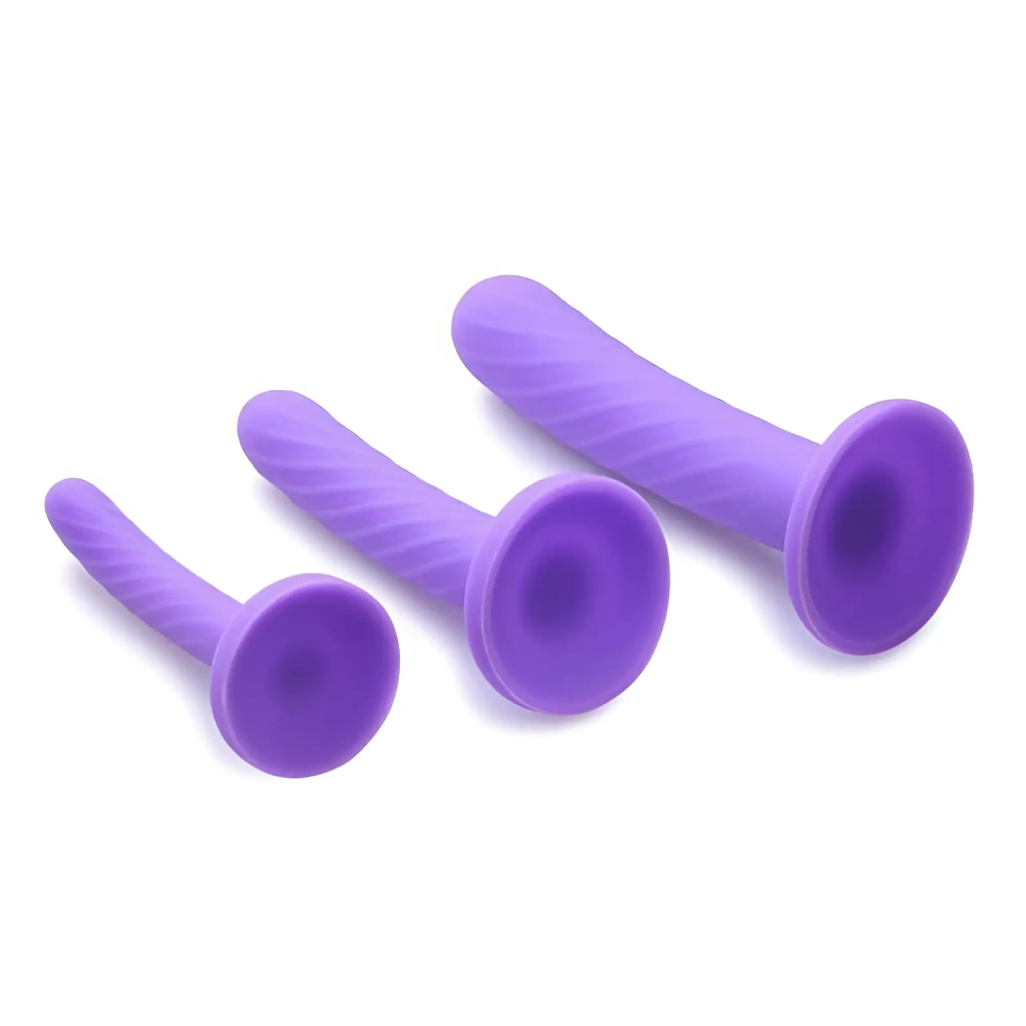 Strap U Tri-Play 3-piece set: three purple, spiral-textured silicone dildos with suction cup bases on a white background.