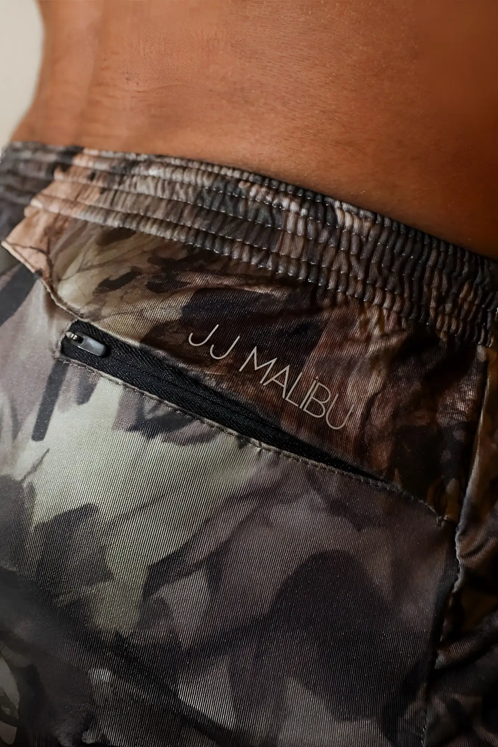 Stretch-it 2 inch athletic short shorts in leaf camo featuring jj malibu shorts with black zipper and embroidered logo