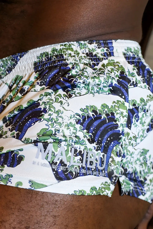 White stretch-it 2 inch athletic short shorts featuring blue and green wave pattern with gray malibu logo