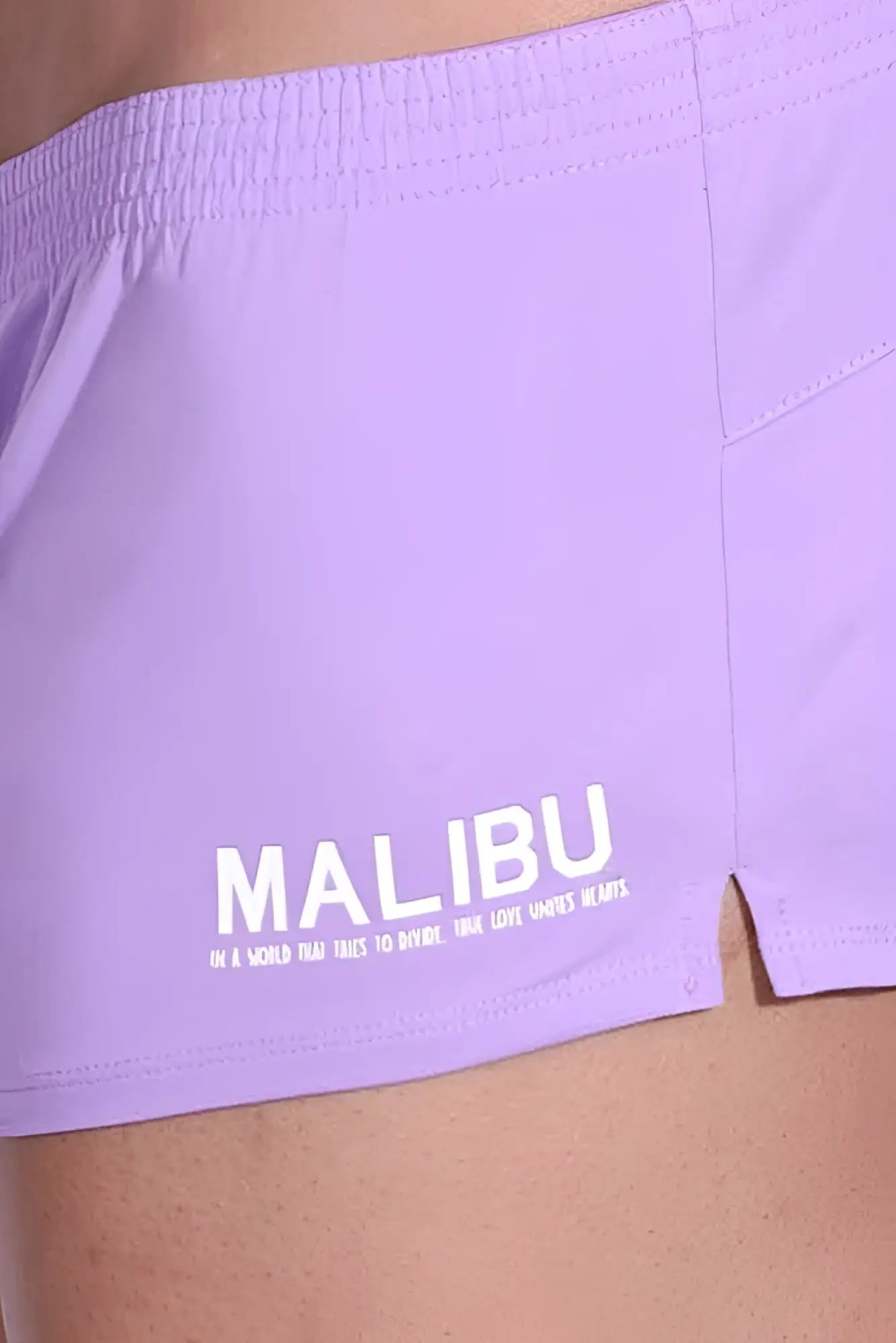 Stretch-It 2 inch bright lilac shorts by lavender malibu with white logo and slogan printed on the side