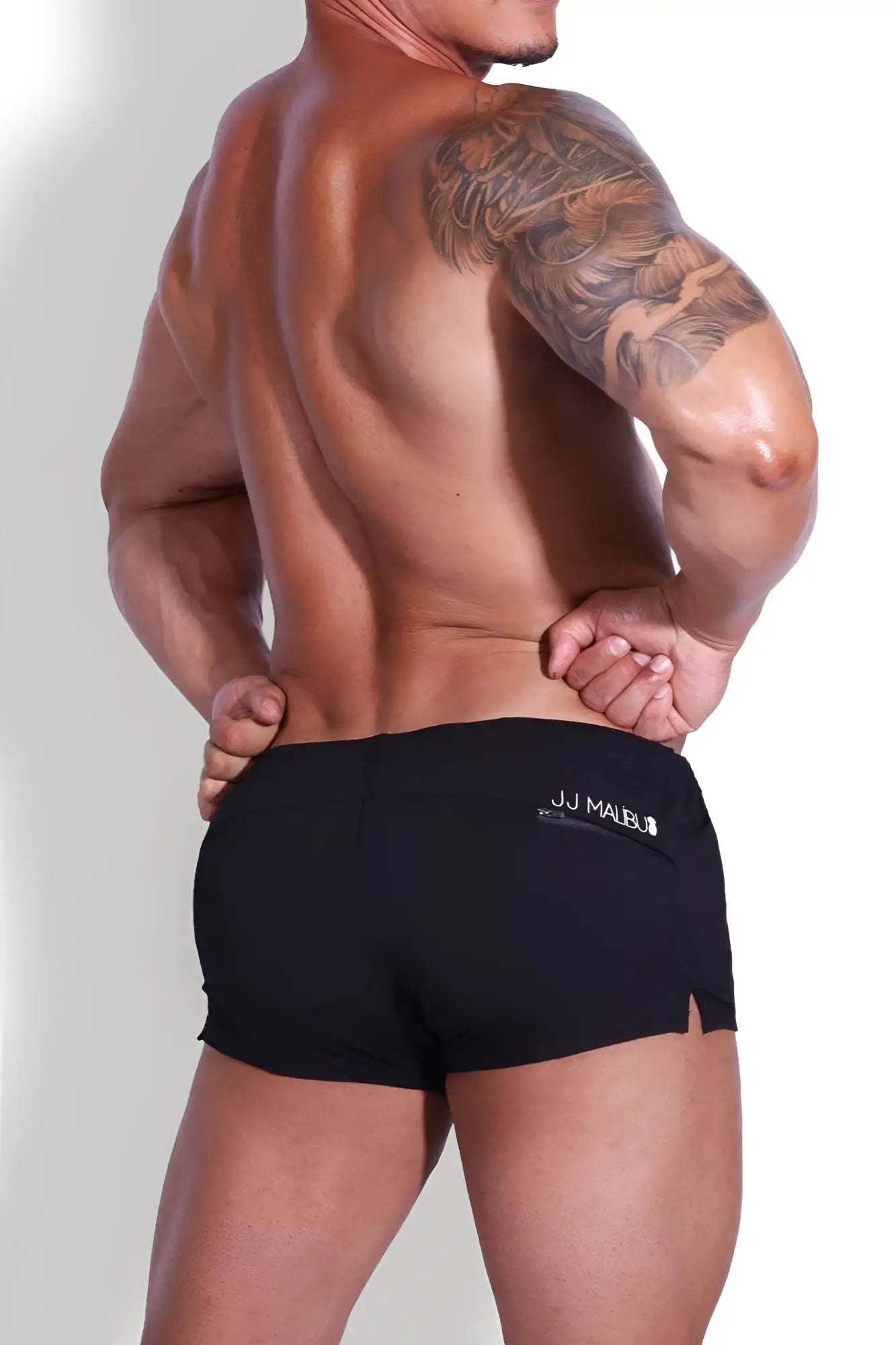 Black jj malibu stretch-it 2 inch short shorts with subtle side slit and logo waistband in midnight black