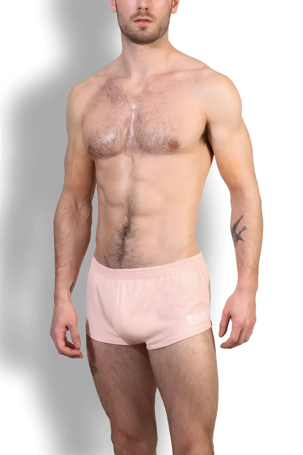 Stretch-it 2 inch short shorts in nude pink featuring pink athletic briefs with subtle white logo on waistband