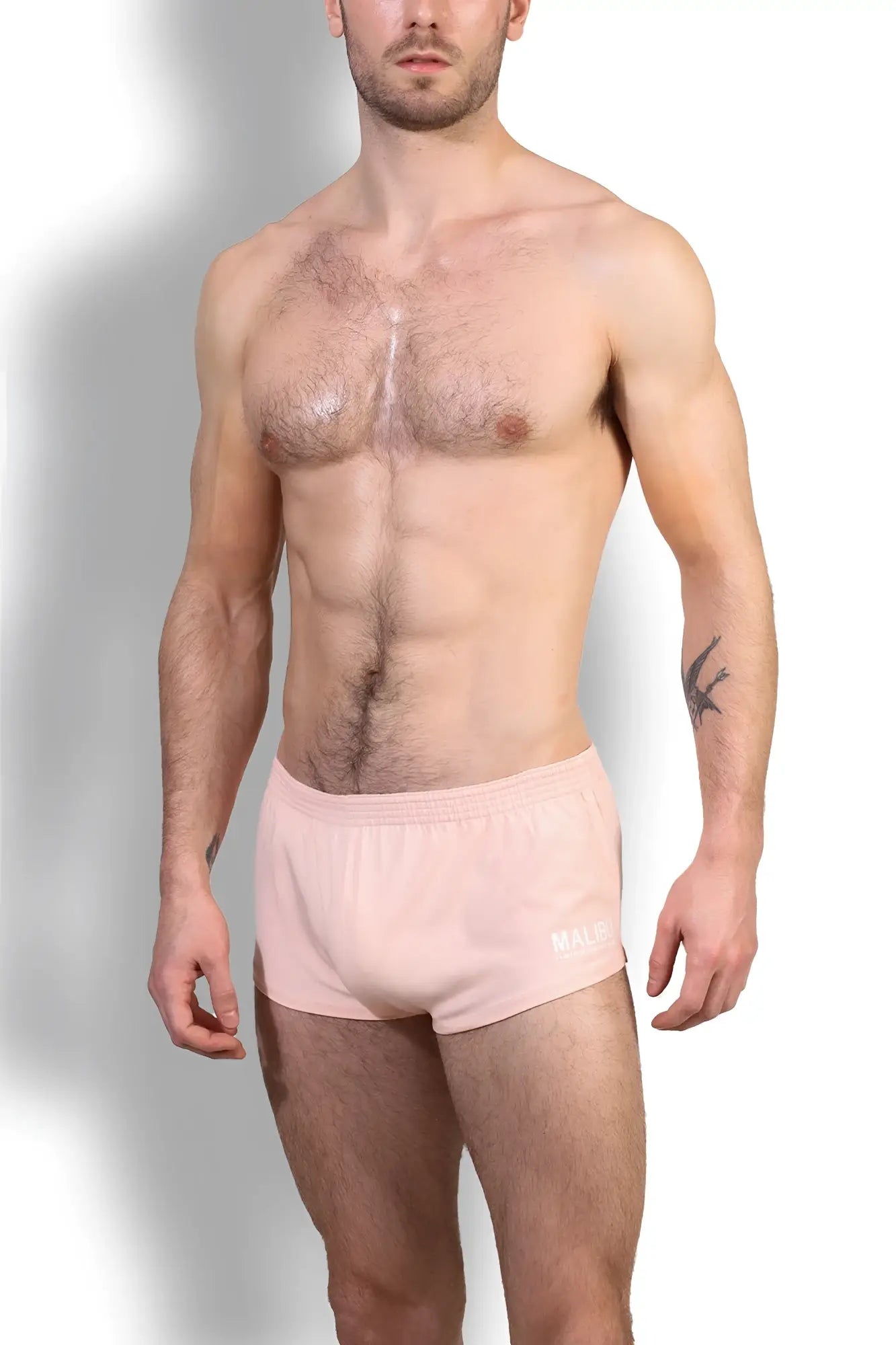 Stretch-it 2 inch short shorts in nude pink featuring pink athletic briefs with subtle white logo on waistband