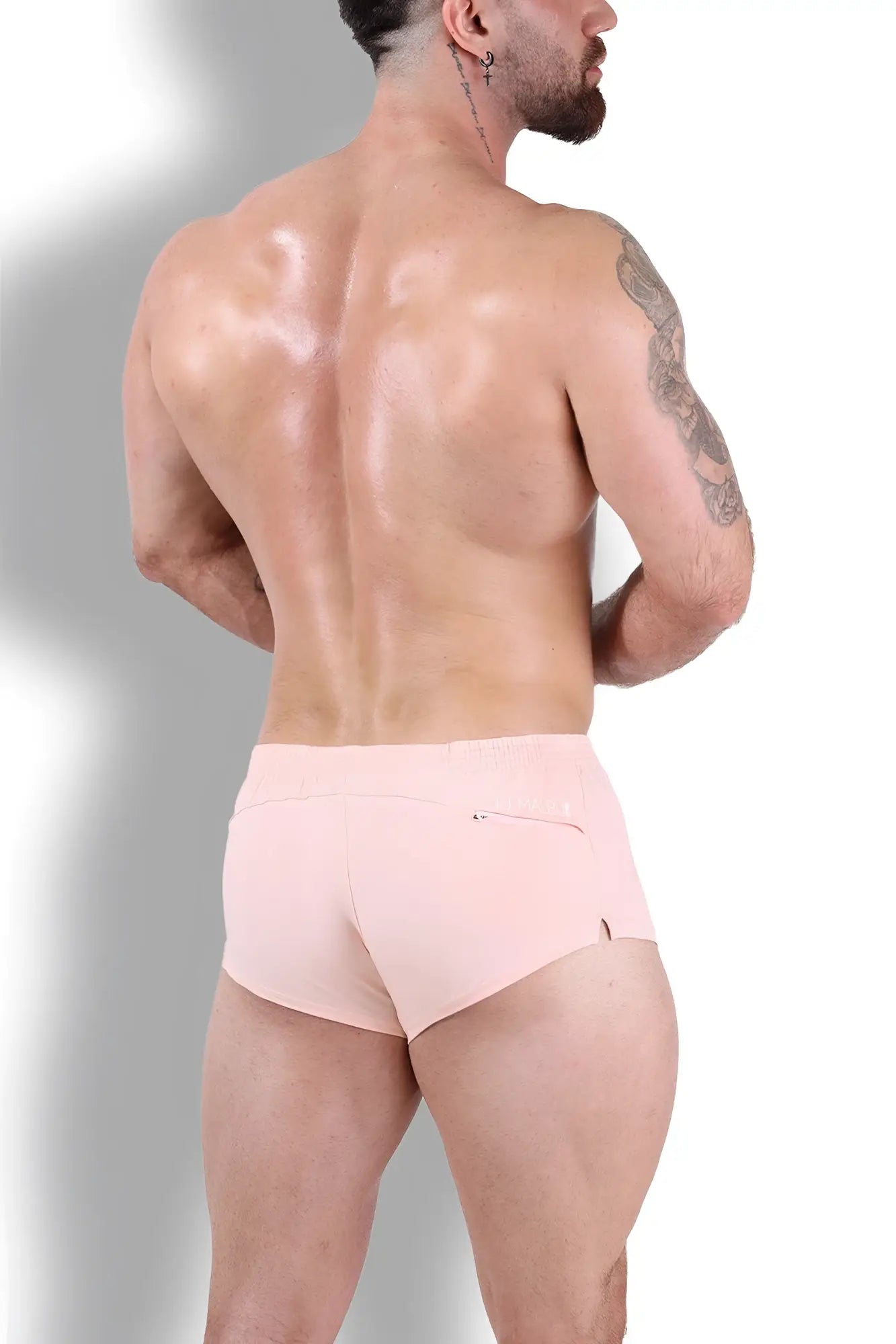 A pair of light pink nude pink stretch-it 2 inch short shorts with a subtle side pocket and minimalist design