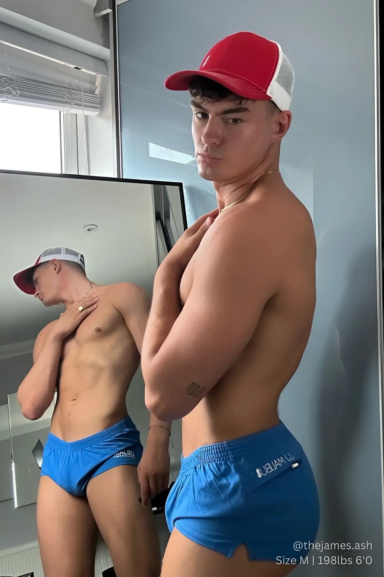 Blue stretch-it 2 inch short shorts with white logo on the side designed for athletic performance