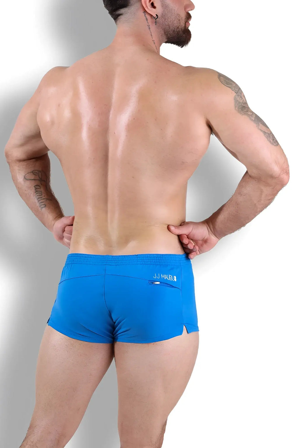 Bright blue jj mreu stretch-it 2 inch swim trunks with small front pocket and brand logo on waistband