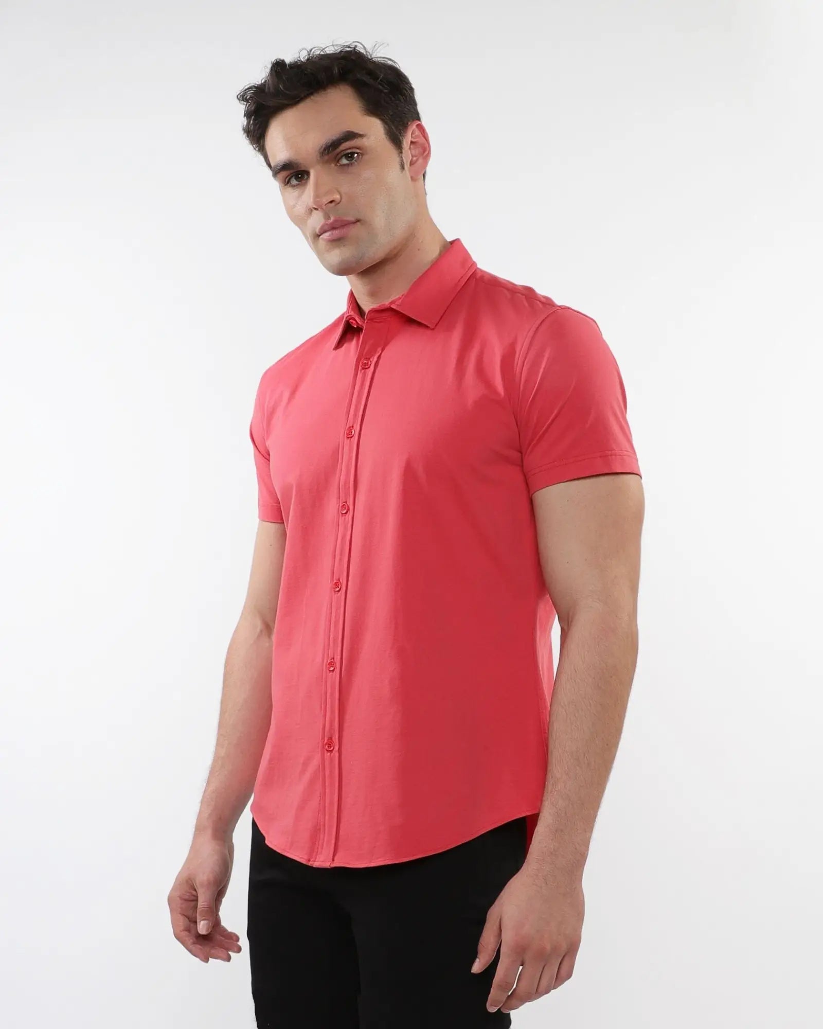A vibrant coral-colored stretch knit short-sleeved shirt with a classic collar and tailored fit