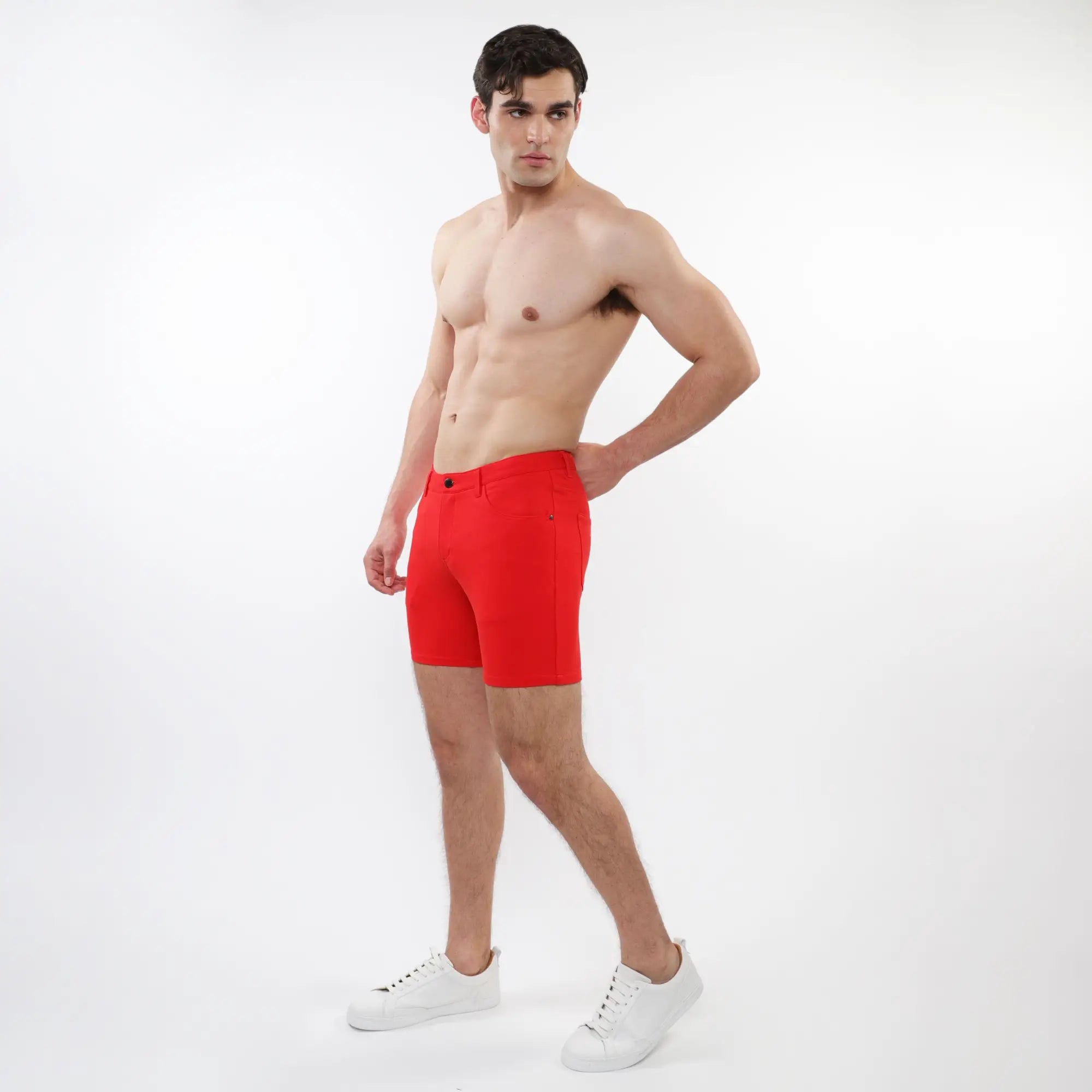 Bright red stretch knit men’s shorts with a classic five-pocket design and button closure for comfortable wear