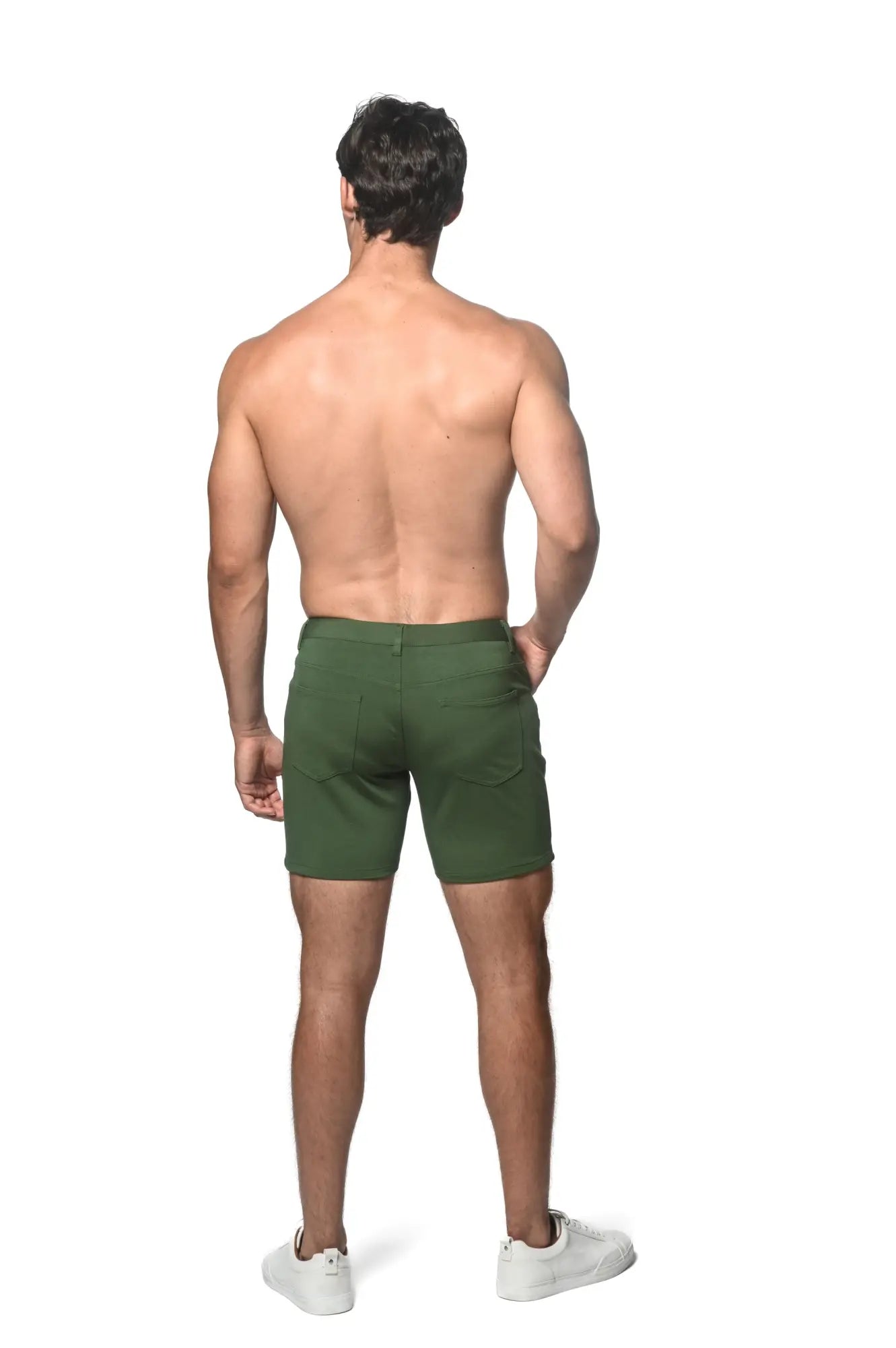 Dark green stretch knit shorts with tailored fit and visible back pockets shown from the back side