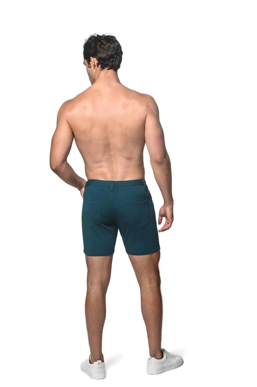 Dark teal stretch knit shorts with sleek modern design and subtle side pockets ideal for athletic wear