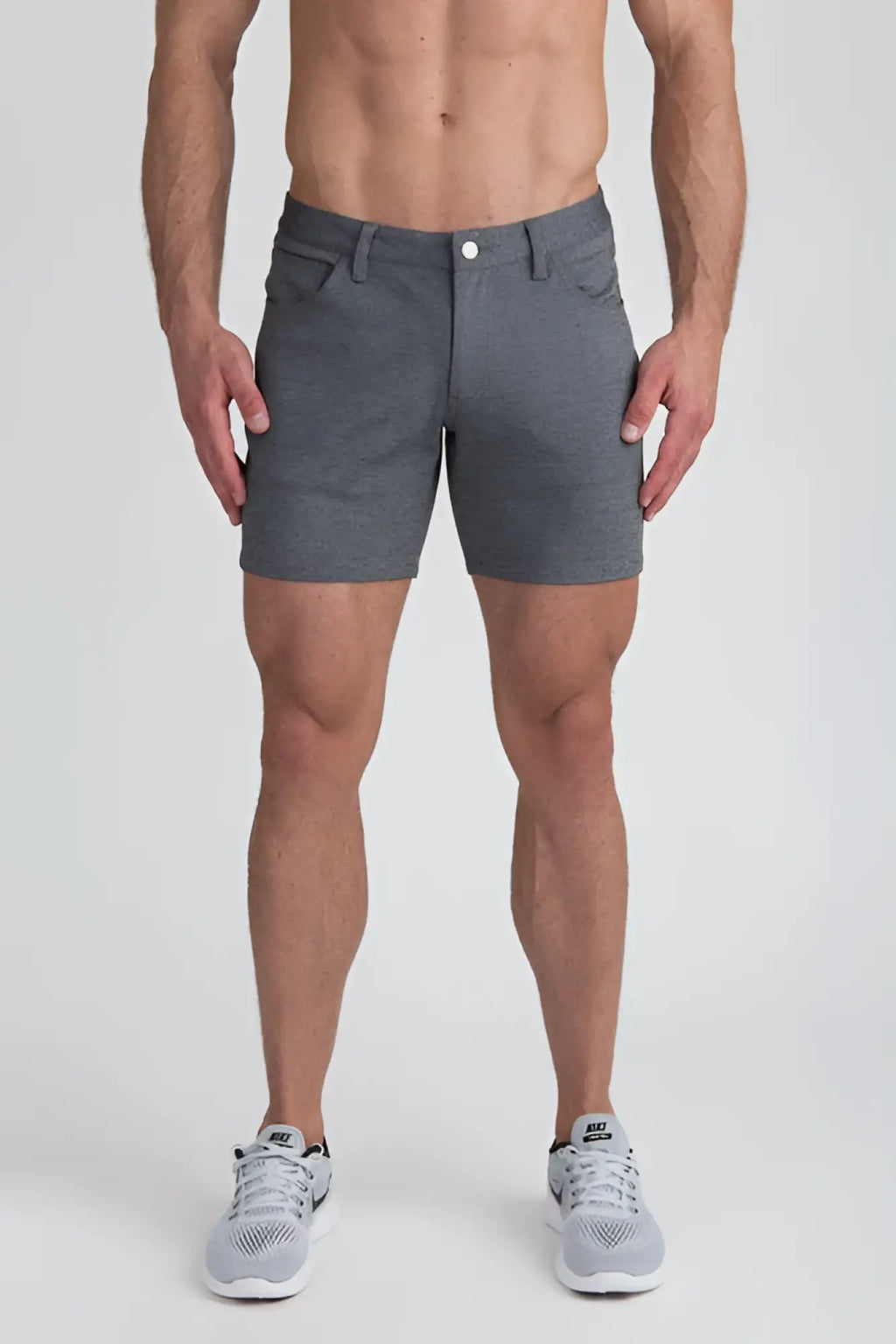 Gray stretch knit shorts with textured fabric button closure and side pockets for comfortable casual wear