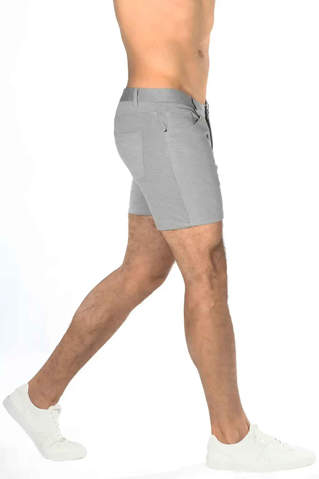 Gray stretch knit shorts with a textured fabric and subtle stitching details in a sleek modern design