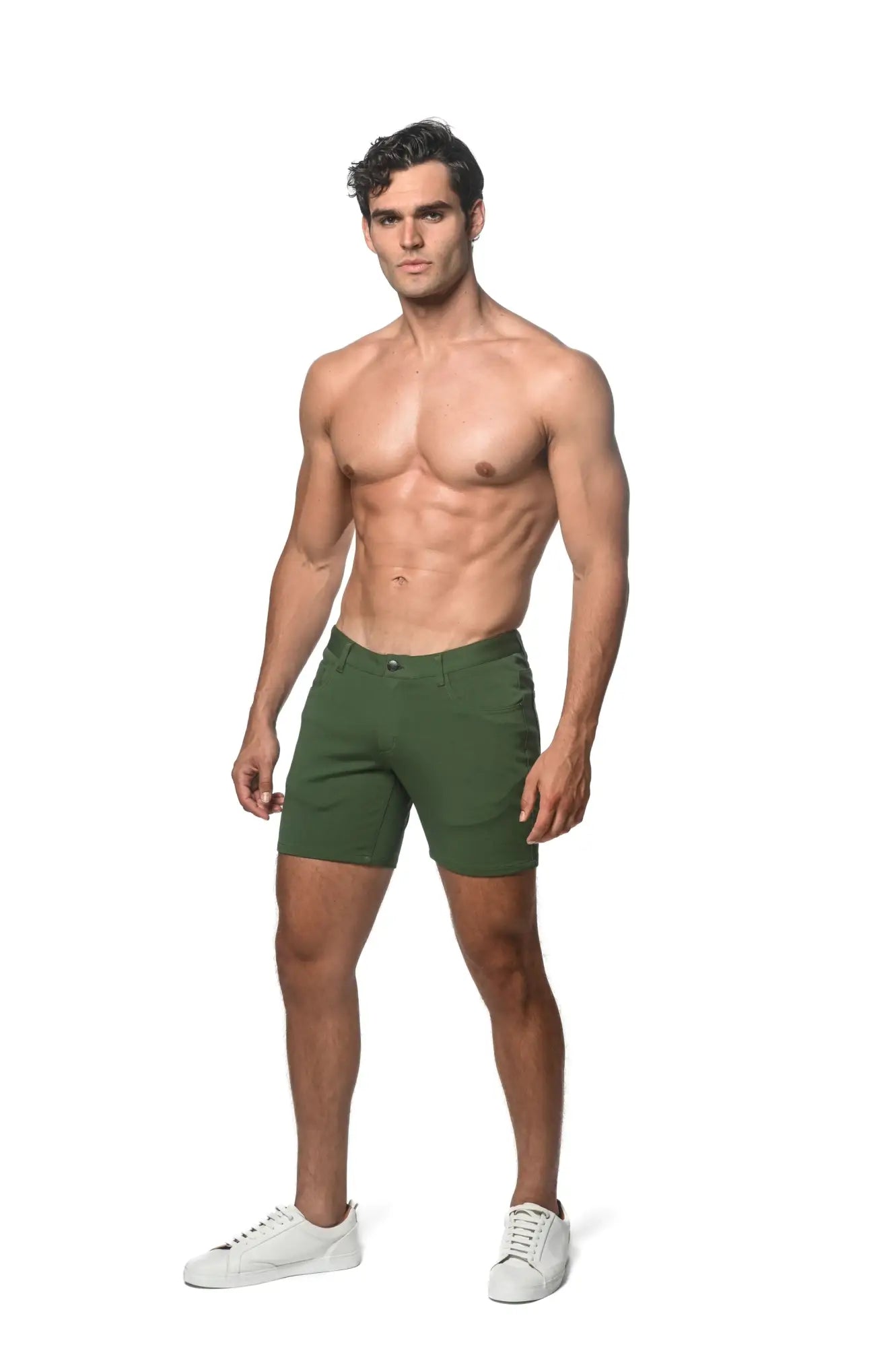 A pair of dark green stretch knit slim-fit chino shorts with classic five-pocket design and belt loops