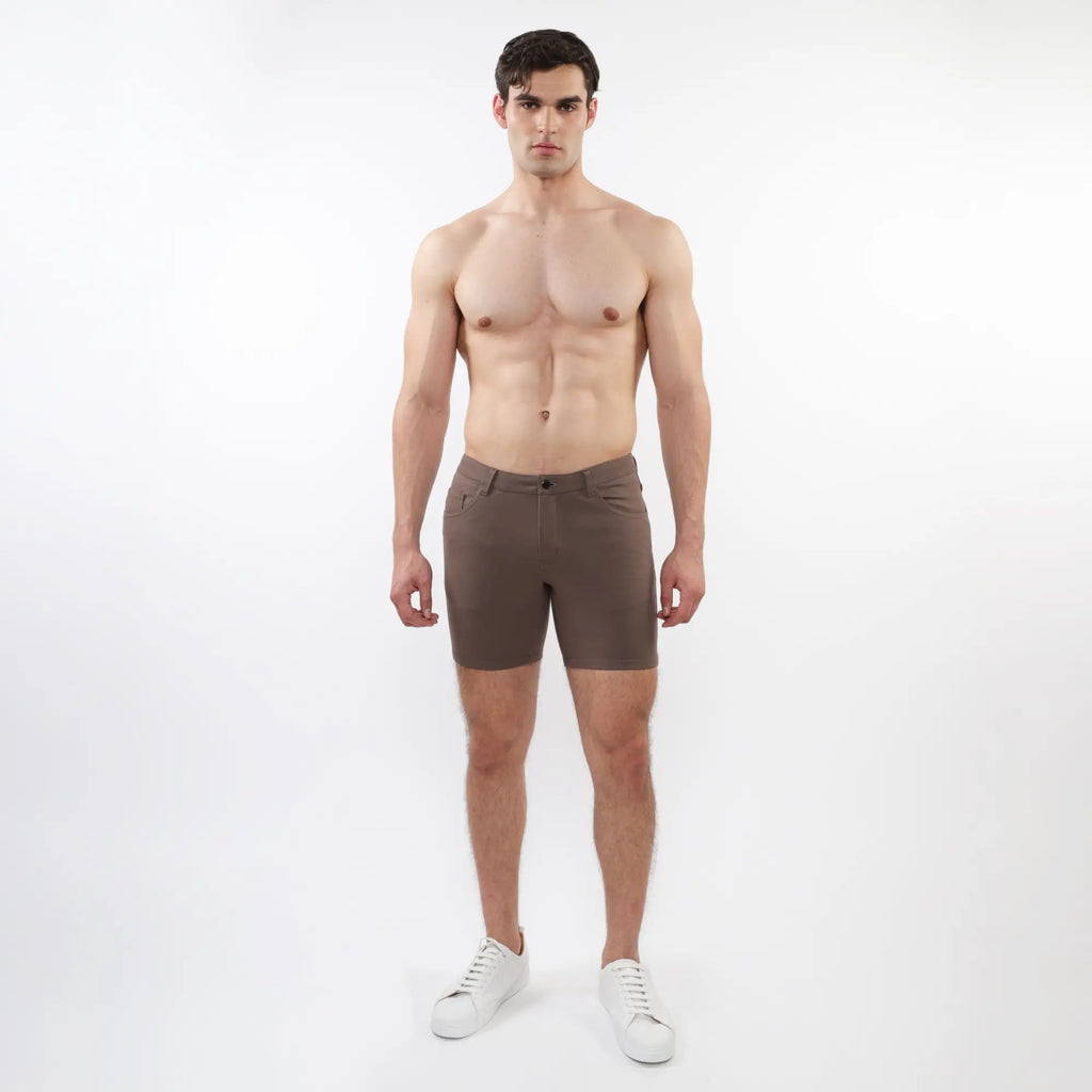 A pair of slim-fit dark brown stretch knit shorts with modern design and subtle stitching details