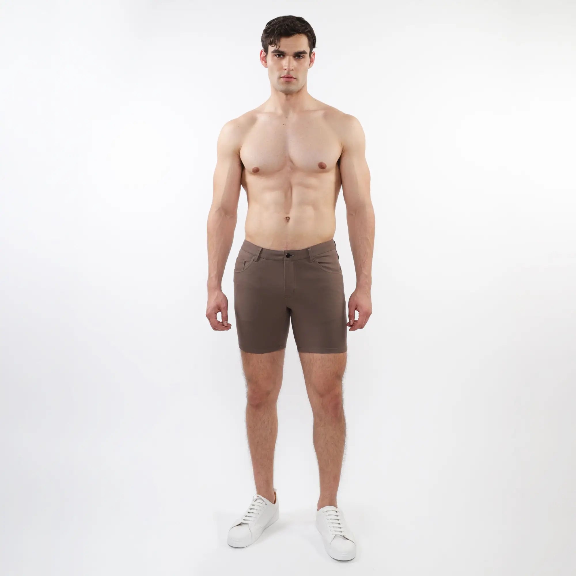 A pair of slim-fit dark brown stretch knit shorts with modern design and subtle stitching details